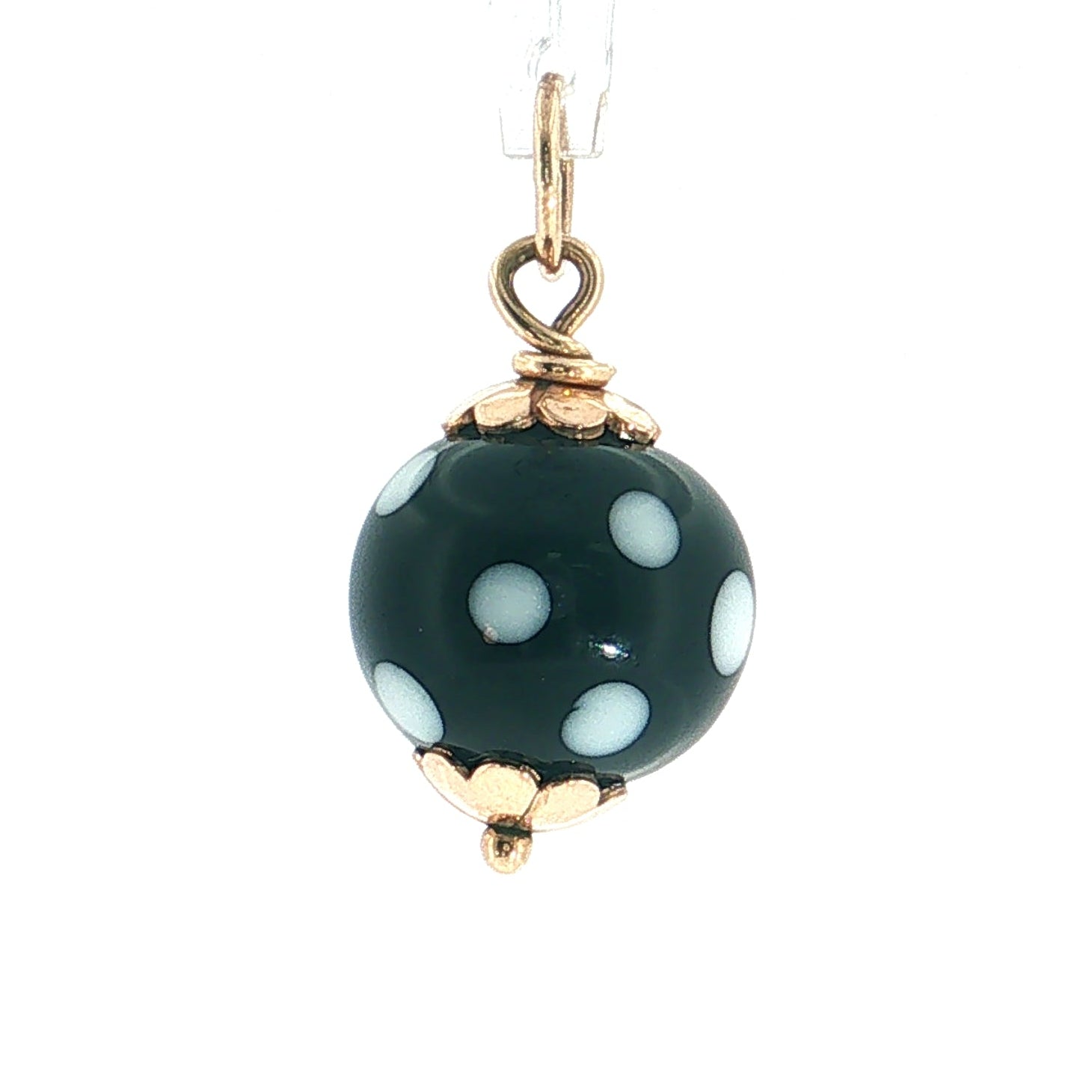 A single dome-shaped glass bead pendant with a dark green base, decorated with white polka dots and accented by gold-tone metal caps, hanging from a clear string against a plain white background.