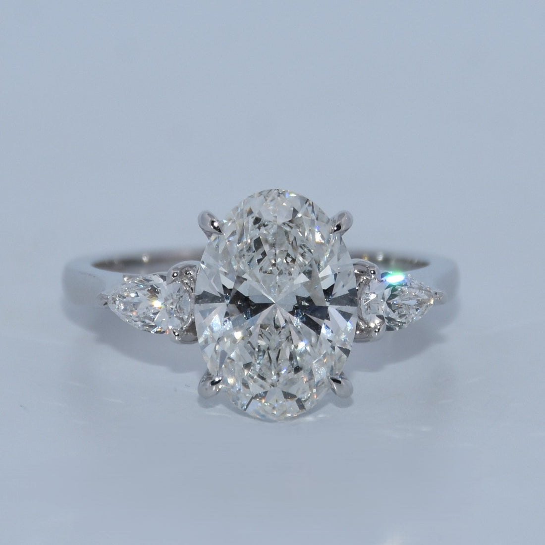 14K Gold | 3CT WG three-stone Oval Lab Diamond with Pear Side Stones Engagement Ring
