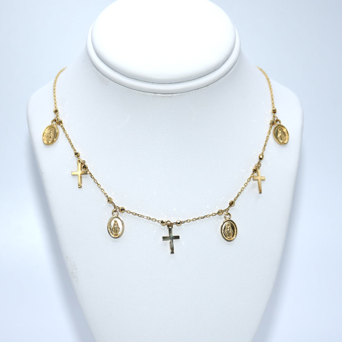 Gold necklace with various charms 