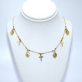 Gold necklace with various charms 