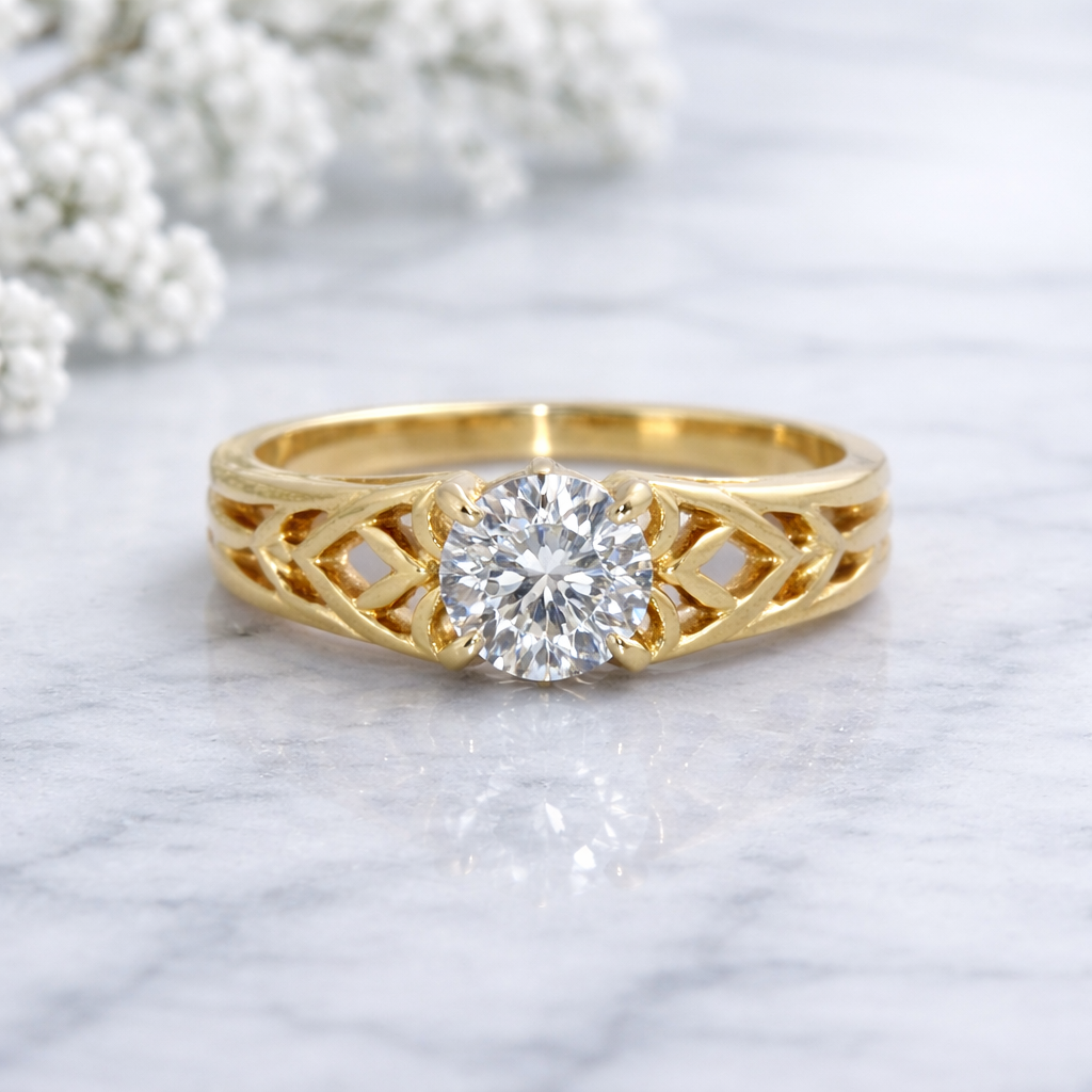 Gold ring with diamond on a marble surface