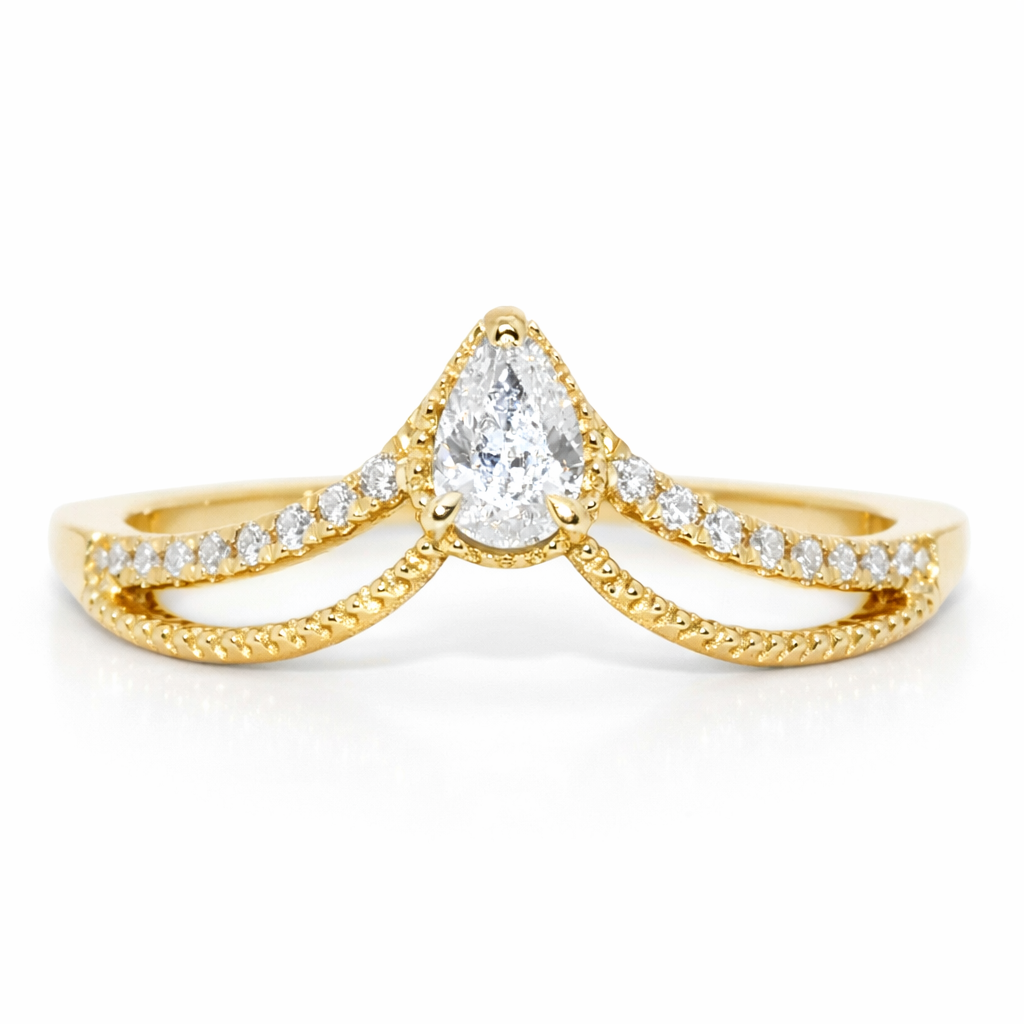 Gold ring with a pear-shaped diamond and smaller diamonds on a white background