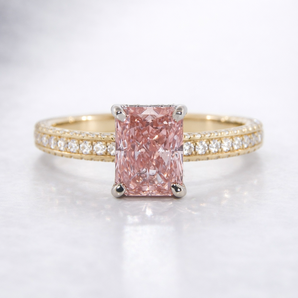 Gold ring with a pink diamond and smaller diamonds on a light gray background