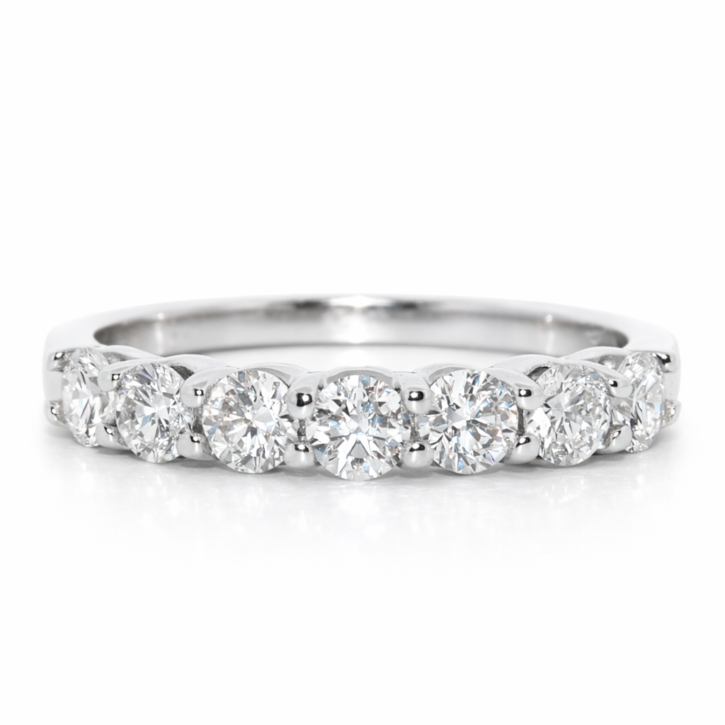 Diamond ring with multiple stones on a white background
