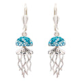A pair of silver leverback dangle earrings featuring a glittery blue jellyfish design with silver tentacles, shown against a plain white background.