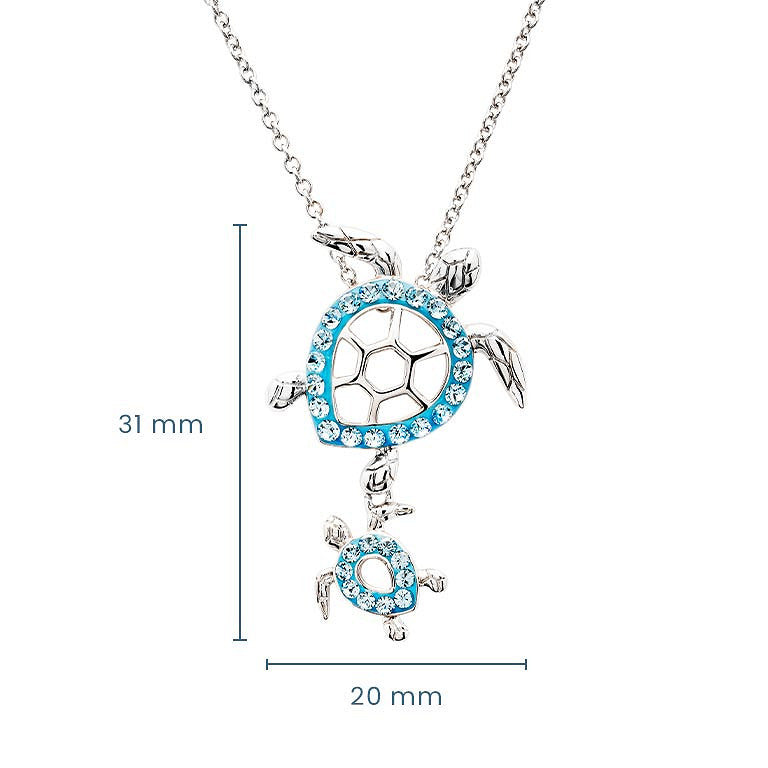 Silver turtle pendant necklace with blue rhinestone accents and a smaller dangling turtle charm, shown on a white background with measurement lines indicating 31 mm height and 20 mm width.