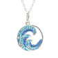 A silver wave-shaped pendant necklace featuring light blue and royal blue rhinestones, shown on a clean white background.