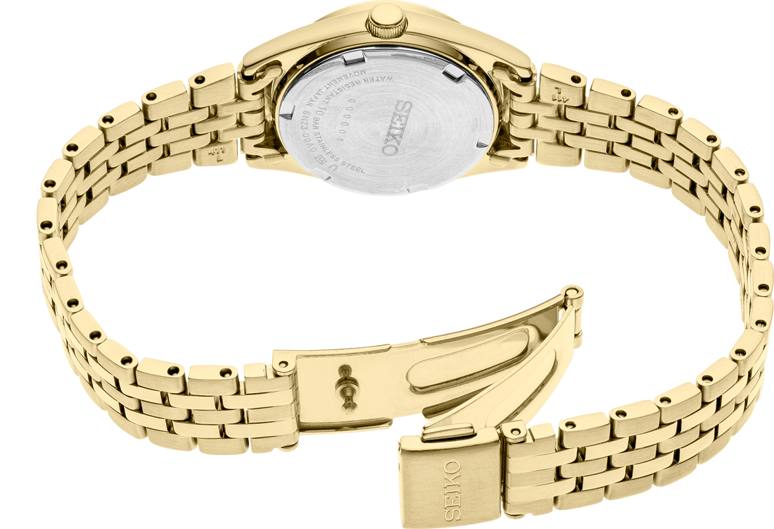 Gold watch with metal band on a white background