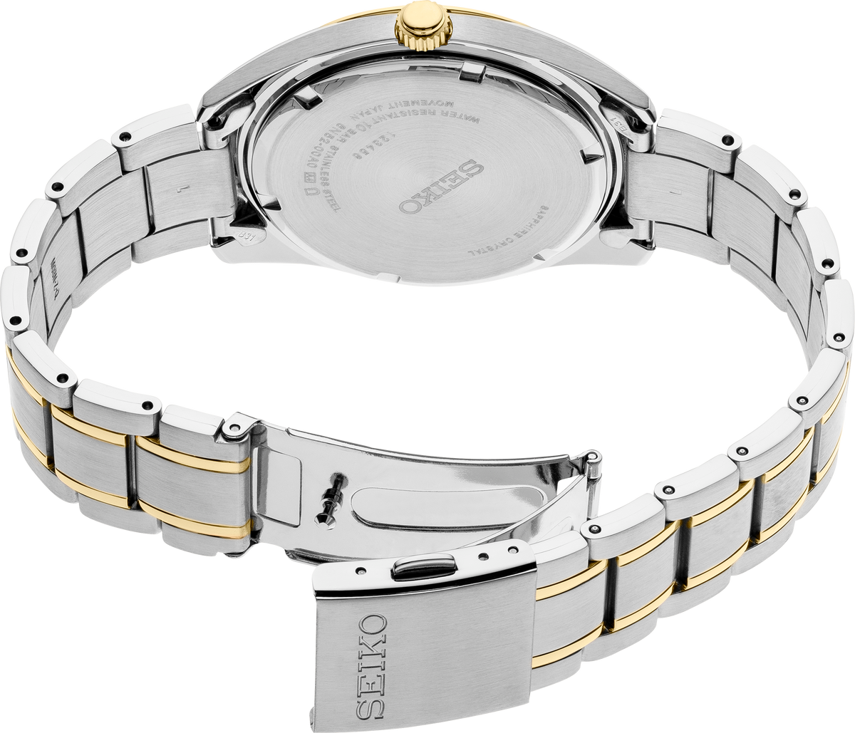 Close-up of a Seiko watch with a two-tone metal band on a white background