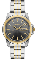 Seiko watch with two-tone metal strap on a white background