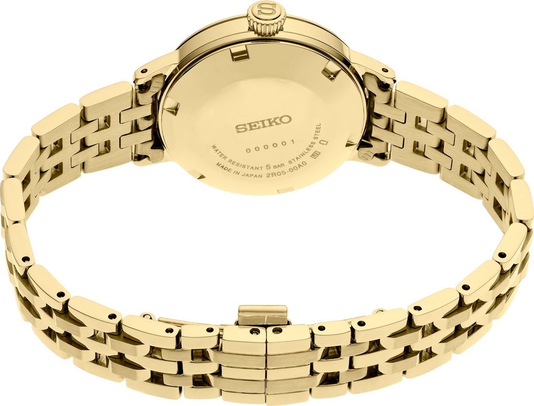 Gold Seiko watch with a detailed metal band on a white background