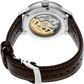Seiko watch with brown leather strap and visible mechanical components on a white background