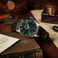 Green Seiko watch on an old book with a vintage setting