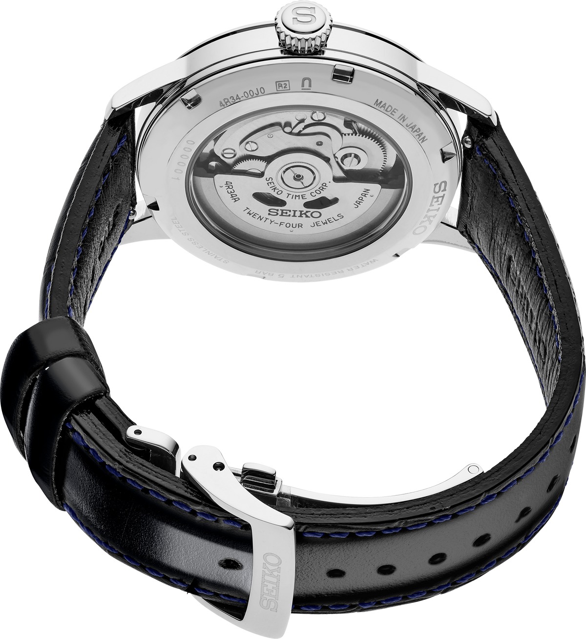 Close-up of a Seiko watch with black leather strap and visible mechanical components.