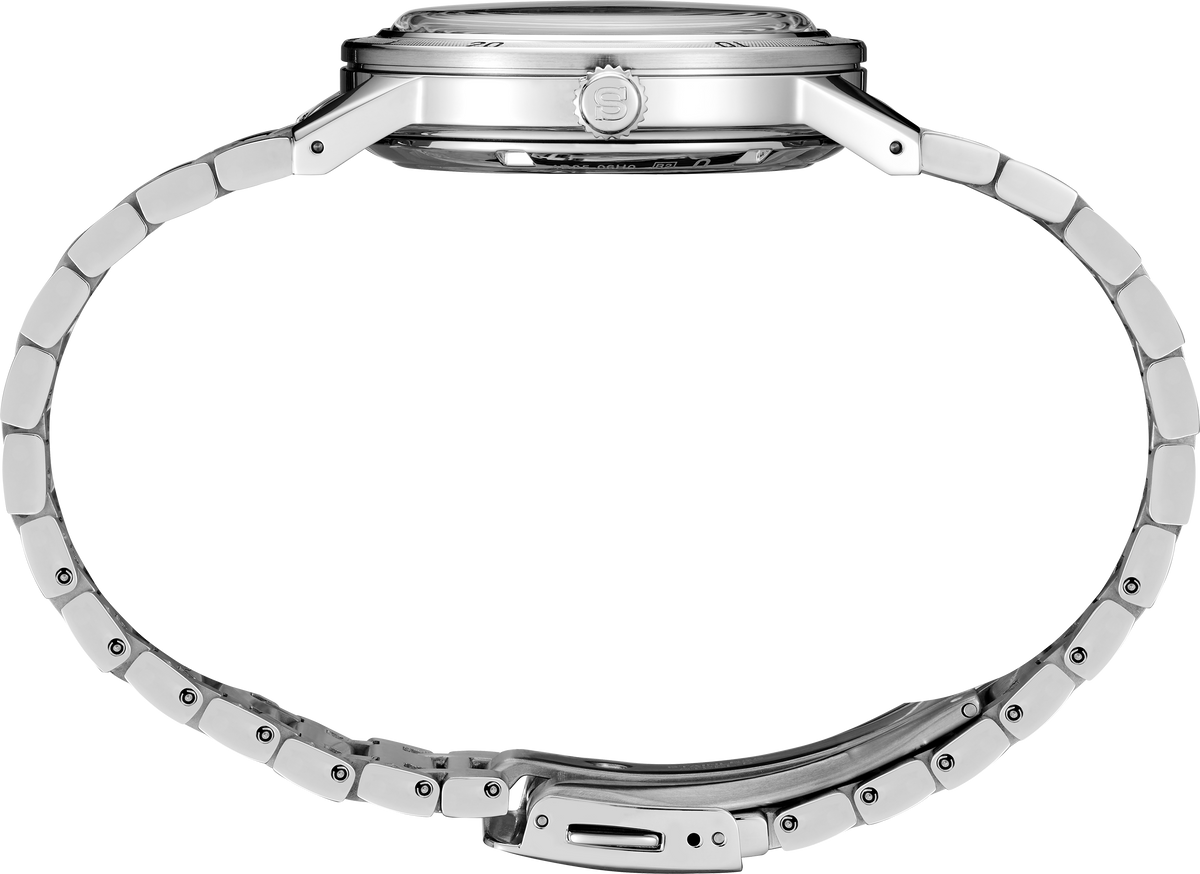 Close-up of a silver watch band on a white background