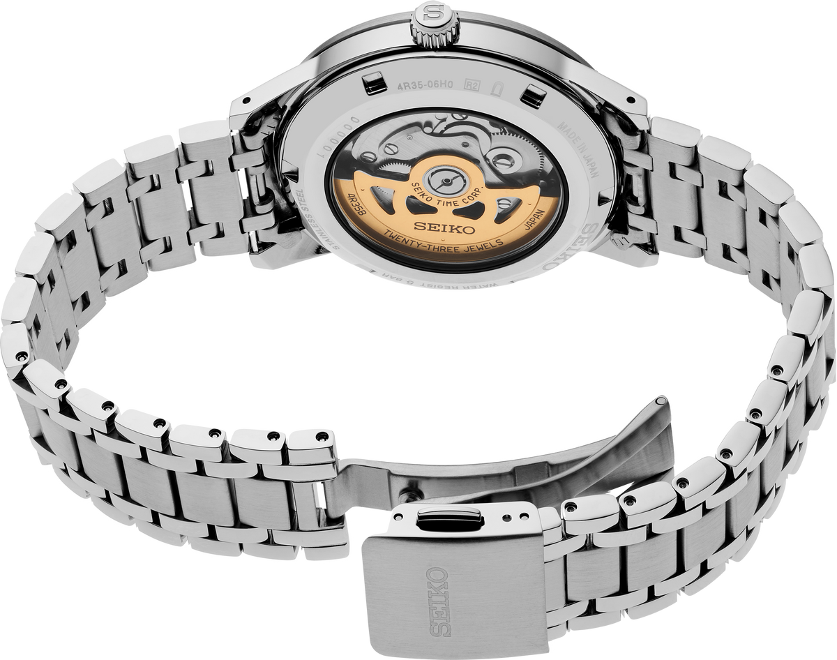 Silver Seiko watch with metal bracelet on a white background