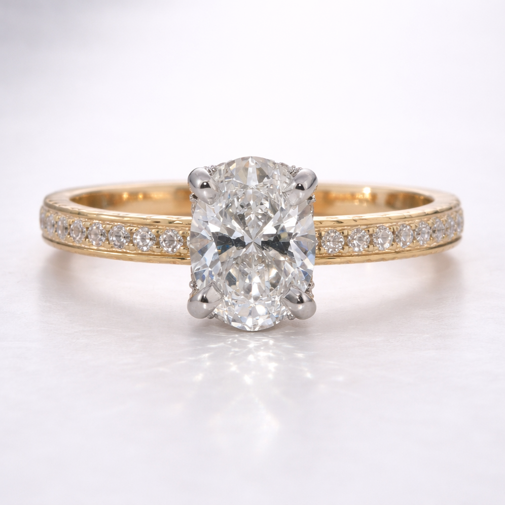 Gold ring with a large diamond and smaller diamonds on the band against a white background
