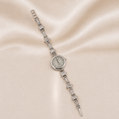 Silver bracelet watch with diamond accents on a beige fabric background Sterling Silver | Argento .925 Quartz Watch Bracelet