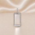 Silver pendant with diamond accents on a satin surface Sterling Silver | CZ Dog Tag Pendant