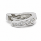 A silver-toned wrap ring featuring a channel-set row of clear round-cut diamonds on one of the crossing bands, photographed on a clean white background.