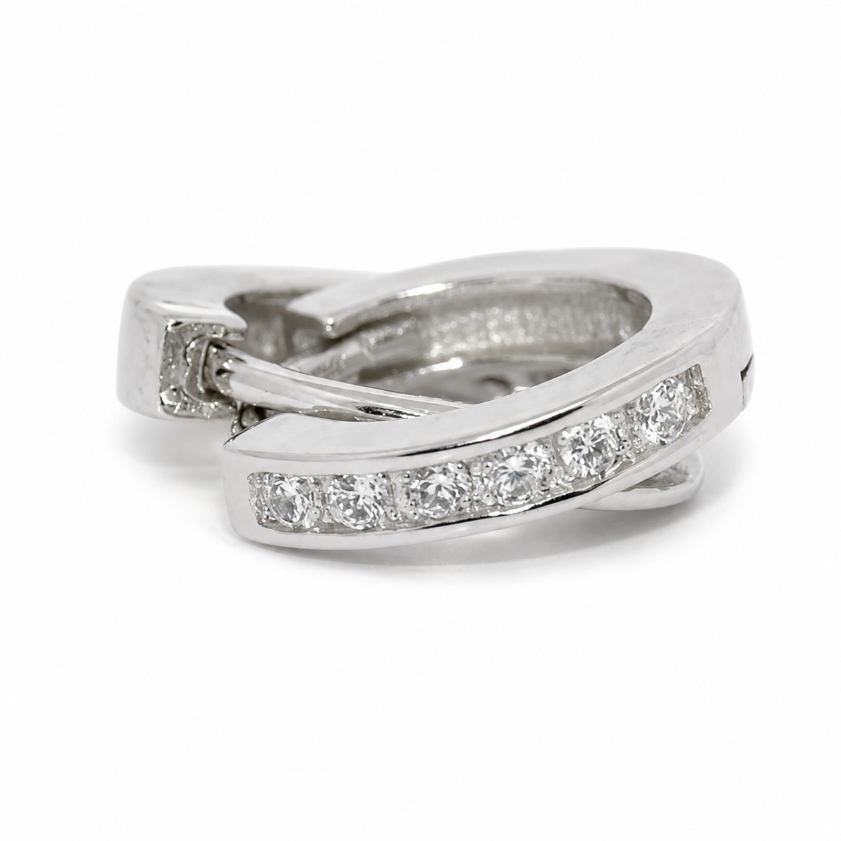 A silver-toned wrap ring featuring a channel-set row of clear round-cut diamonds on one of the crossing bands, photographed on a clean white background.