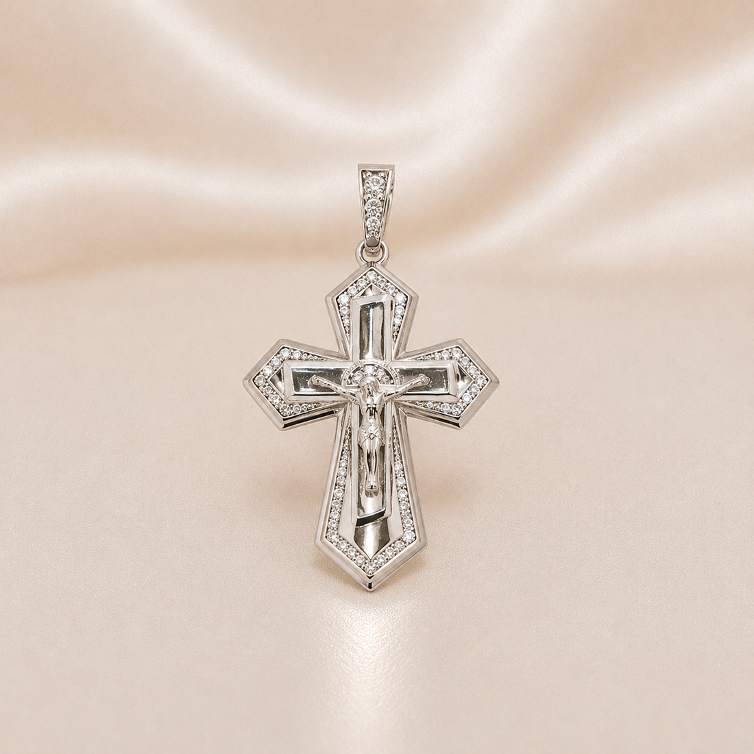 Silver cross pendant with intricate design on a soft pink background Sterling Silver | Large Crucifix Pointed Cross CZ Pendant