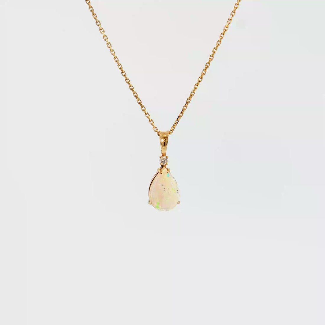 14K Gold | Yellow Gold Pear Shaped 1.05CT Opal Pendant with .03CT Round Natural Diamond