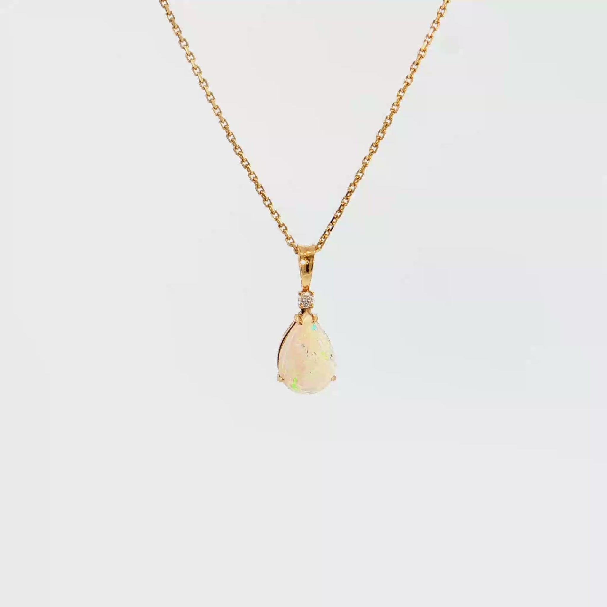 14K Gold | Yellow Gold Pear Shaped 1.05CT Opal Pendant with .03CT Round Natural Diamond